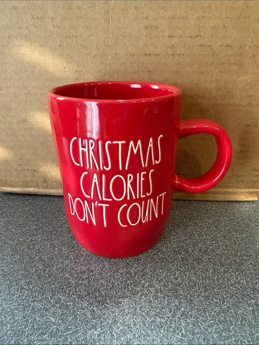 Rae Dunn Red Ceramic Mug with White Script Holiday Slogan
